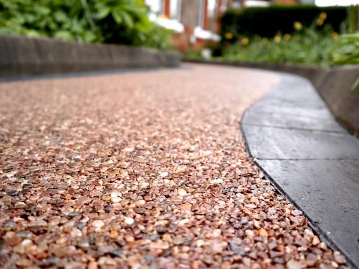 Resin bound surface close-up showing aggregate and edging